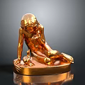 Decorative Furniture Piece Featuring Golden Reclining Human Figure Sculpture With Shiny Base