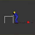 Man wearing blue uniform with yellow safety helmet welding metal frame near red welding machine