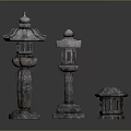 Traditional Stone Lanterns With Different Sizes And Intricate Carved Details