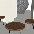 Minimalist Modern Round Wooden Coffee Tables With Black Slender Legs White Walls And Sculptural Object