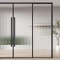 Modern Sliding Door With Black Frame Ribbed Glass In Interior With Wooden Floor And Plant