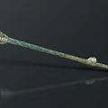 Ancient Bronze Sculpture With Elongated Shape And Carved Decorative Details