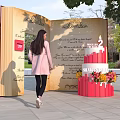 Open Book Installation with Red Cake Number 2 Shamsurhuda and Woman in Pink Coat Outdoor