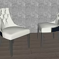 Pair of Beige Tufted Leisure Chairs With Curved Back Design And Black Wooden Legs