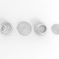 Playground Equipment With Silver Metal Spiral Structures In Various Shapes