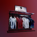 Retail Display Shelf with Digital Screen Showing Visual Merchandising and Hanging Colorful Printed T-shirts
