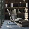 Modern Woven Leisure Chair With Light Gray Cushions And Decorative Shelves Interior Design