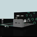 Audi Exhibition Booth With Black Background Hexagon Patterns White Reception Desk Green Plant And Chairs