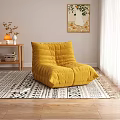 Yellow Velvet Bean Bag Chair in Living Room with Geometric Pattern Rug