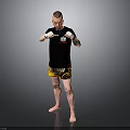 Man In Black T Shirt And Yellow Shorts With White Boxing Gloves Training Stance