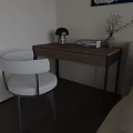 Modern Wooden Desk And White Chair Set With Lamp Books And Vase In Natural Light