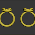 Elegant Gold Rings With Intricate Knot Design And Shiny Surface