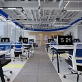 Modern Public Office Area with Open Glass Partition Yellow Sofa Black Coffee Table and Plant