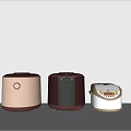 Three Rice Cookers In Various Colors Displayed As Modern Kitchen Appliances