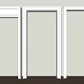 Three White Door Frames In Home Interior With Light Wall And Wooden Floor