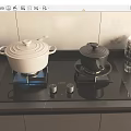 Kitchen Appliances Black Gas Stove With Two White And Black Pots Stacked Glass Cups