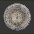 Hand Carved Circular Stone Sculpture With Blue Rim And Textured Surface