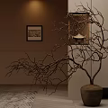 Decorative Bare Branches In Terracotta Pot With Framed Picture And Warm Lighting
