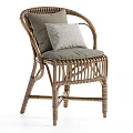 Handwoven Natural Rattan Armchair With Soft Grey Fabric Cushions And Textured Decorative Throw Pillow