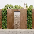 Outdoor Brown Water Feature Wall With Cascading Water And Lush Green Plants