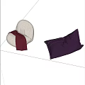 Light Gray Round and Purple Triangular Bean Bag Chairs with Red Blanket on Gray Floor and Light Blue Wall