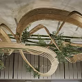 Bamboo Chandelier With Twisted Design And Green Plants In Modern Lobby Interior