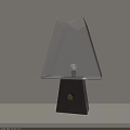 Minimalist Table Lamp Featuring Geometric Fabric Shade And Dark Wooden Base With Lit Bulb