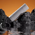 White Vacuum Flask Leaning On Black Rocks With Orange Background And Water Reflection