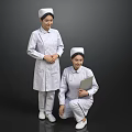 Two Nurses In White Uniforms With Nurse Caps Standing And Kneeling Holding Clipboard