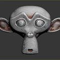 Gray Monkey Head Sculpture With Large Eyes Prominent Nose And Ears