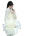 Woman In Light Colored Traditional Costume Sitting Gracefully With Elegant Updo Hairstyle Holding Object