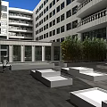 Courtyard Garden Landscape with Surrounding Buildings Paved Ground Stepped Seats and Green Plants