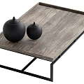 Wooden Coffee Table With Black Metal Legs And Wood Grain Surface Featuring Black Decorative Objects