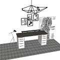 Modern Office Desk With Geometric Pendant Light Framed Artworks And Large Architectural Drawing