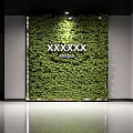 Decorative Green Plant Wall Design With White Text Elements And Lush Foliage
