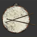 Traditional Decorative Drum With Black Body Red White Trim Floral Patterns And Wooden Drumsticks