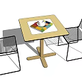 Modern Outdoor Table With Wooden Top And Metal Frame Chairs Featuring Colorful Tray