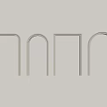Modern Minimalist Wall Decor With Various Shaped Metal Frames On Light Colored Wall