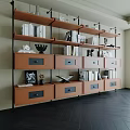 Modern Bookcase With Black Metal Frames Multiple Wooden Shelves Drawers Books And Decorations