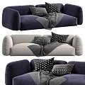 Two Seater Sofa In Navy And Gray With Black White Patterned Pillows And Gray Blanket