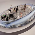 Elegant Wine Bottles And Glasses In Silver Oval Ice Bucket With Ice Cubes