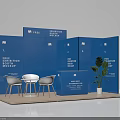 Blue Exhibition Booth Mockup With White Chairs Table And Green Plant