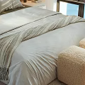 Double Bed Bedroom Interior With Bedspread Pillows Nightstand Lamp Blinds And Sunlight