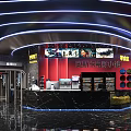 Modern Cinema Interior Design With TicketBox Red Curtains Neon Lights Marble Floors And Green Plants
