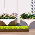 Outdoor Flower Pots with Pink Blooms Green Plants and Yellow Flowers Against White Wall