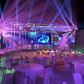 Modern Event Stage With Purple Blue Lighting Large Screen 20 Logo Round Tables And Chairs