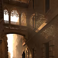 Historic Commercial Street With Arched Architecture Stone Balconies And Sunlit Brick Walkway