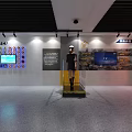 Person Learning Fire Extinguisher Use Method At Fire Safety Exhibition Wall With Flame Design