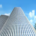 Modern Tall Office Building With Glass Curtain Wall And Blue Sky Background