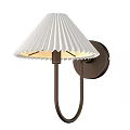 Modern Wall Sconce With White Pleated Shade And Metal Bracket Mounted On Wall